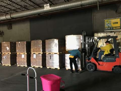 The goods are gathered based on requests and palletized for transport to sites in need.
