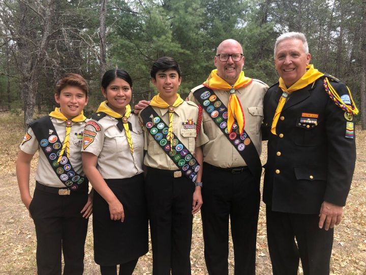 Pathfinder Director, Pastor Craig (far right) standing with Pastor Christian Hodet and his family. Hodet was invested as a Master Guide over the weekend, and he recently accepted a call to serve in central California.