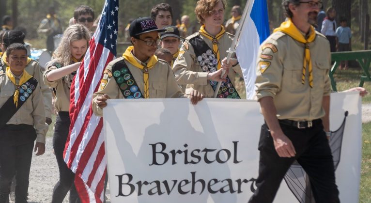 The "Bristol Bravehearts" Pathfinder club marches into the Sabbath morning meeting.