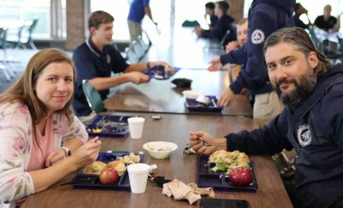 Akenberger (right) and his wife Stephanie (left) enjoy eating lunch with the students. 